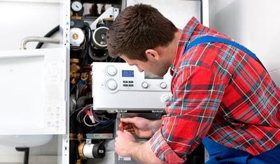 Drinking Water Systems — Technician Servicing Heating Boiler in Racine, WI