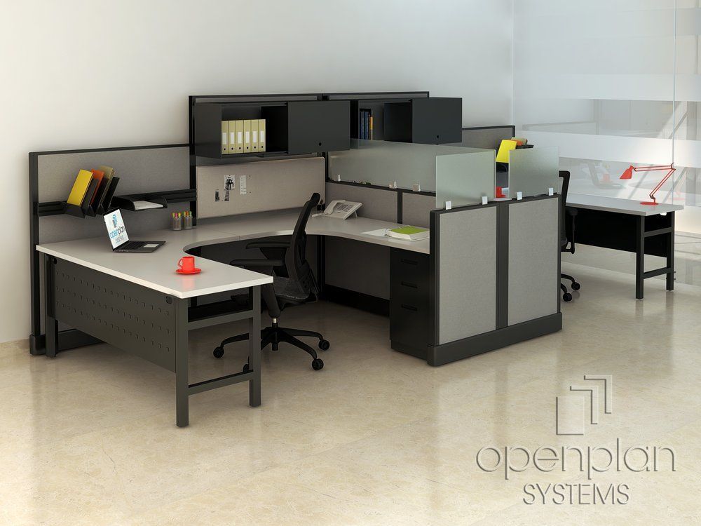 Office cubicles with desks, chairs, and storage in a modern office setting.