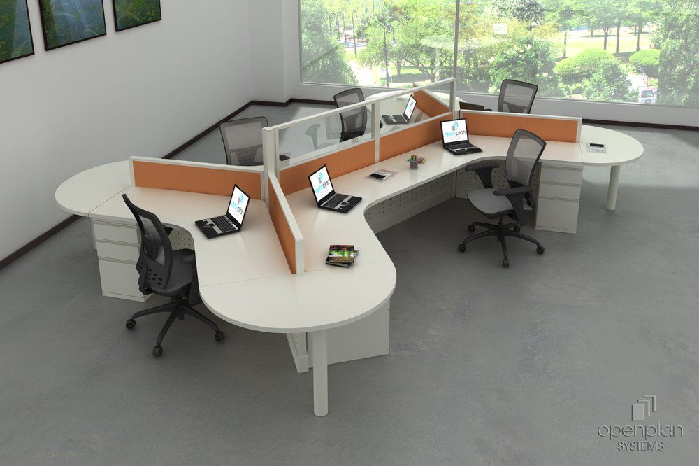 Modern office workstation with six desks, orange dividers, and laptops.