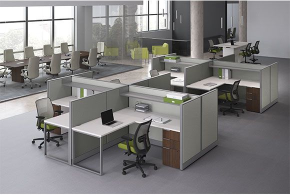 Modern office cubicles with desks and chairs. A boardroom is in the background.