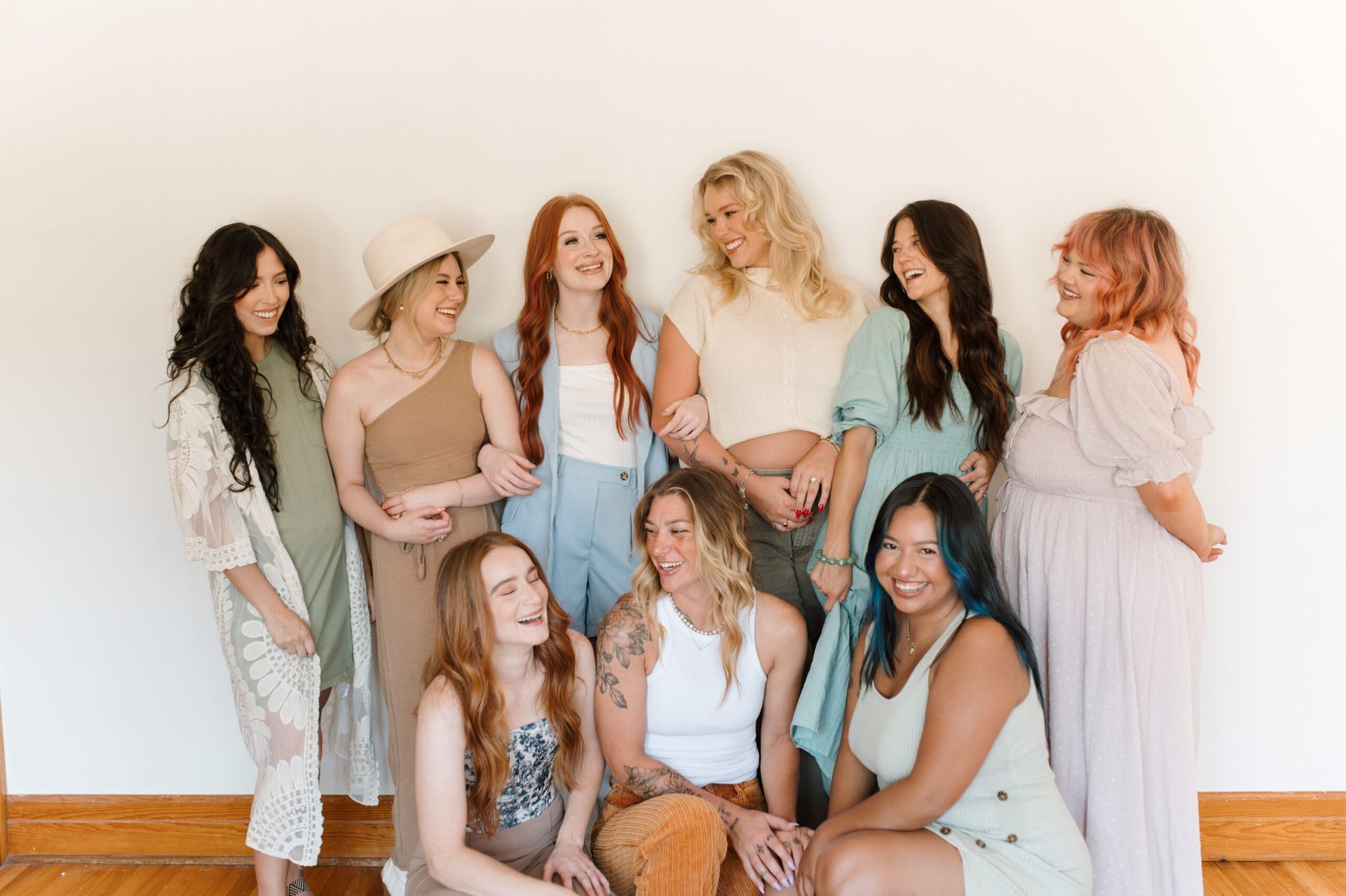 A group of women are posing for a picture together.