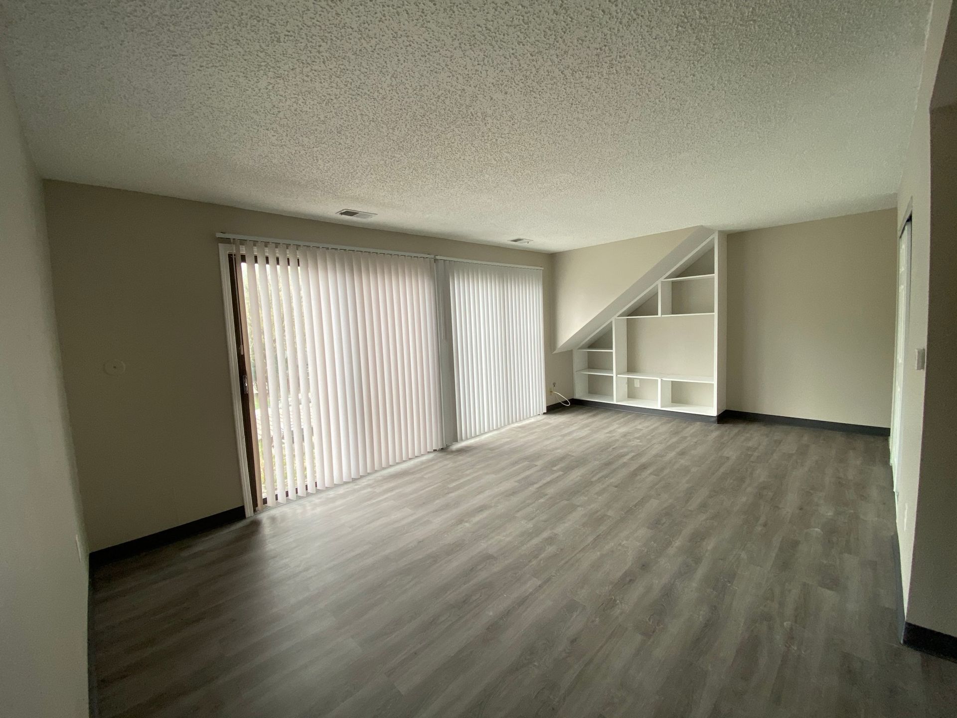 Interior view of a modern apartment unit at Unique Apartment Homes in Ames, IA, featuring spacious living areas and contemporary finishes