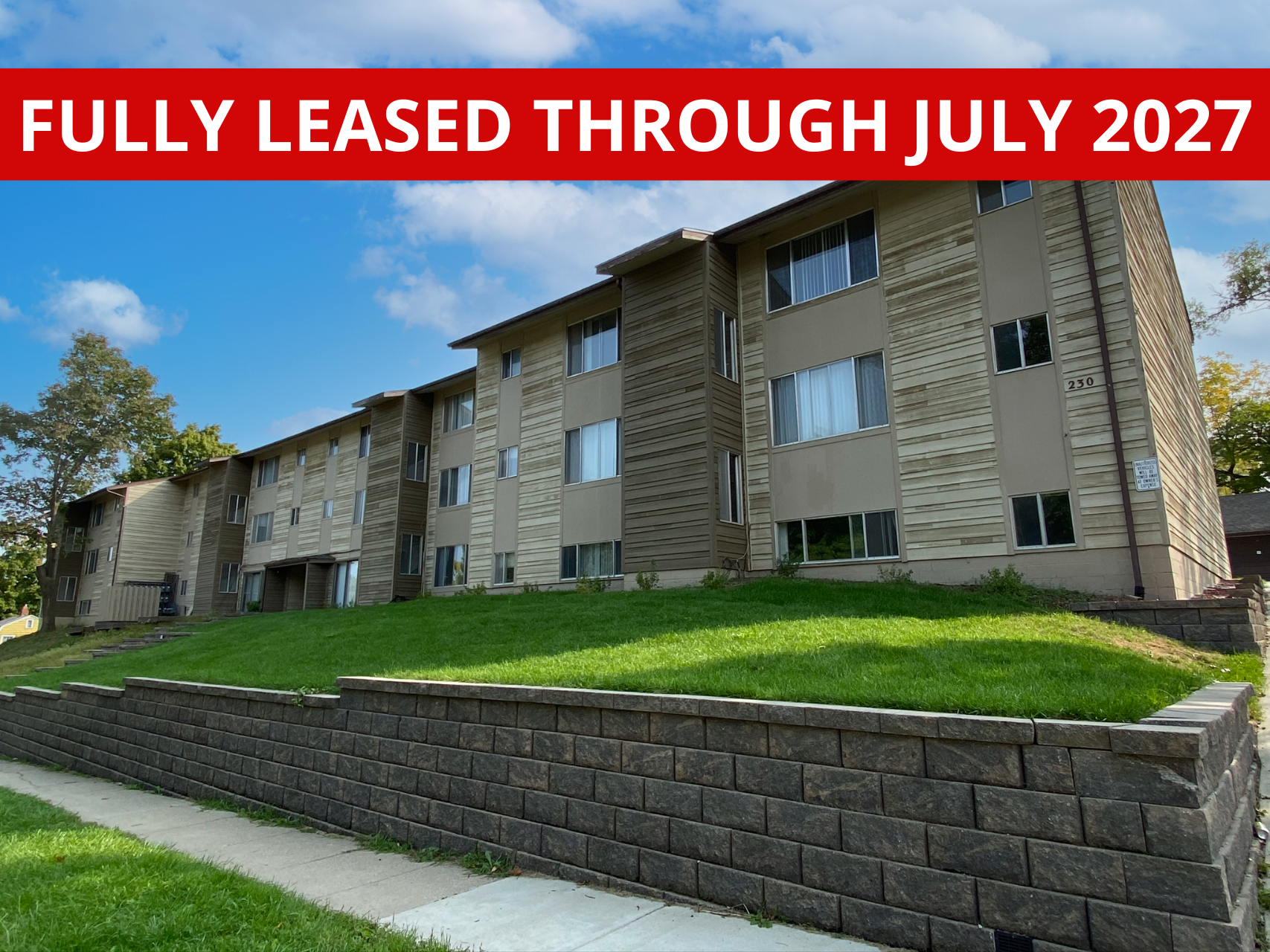Exterior view of 230 Campus, a comfortable apartment building in Ames, IA offering convenient living spaces close to ISU amenities.