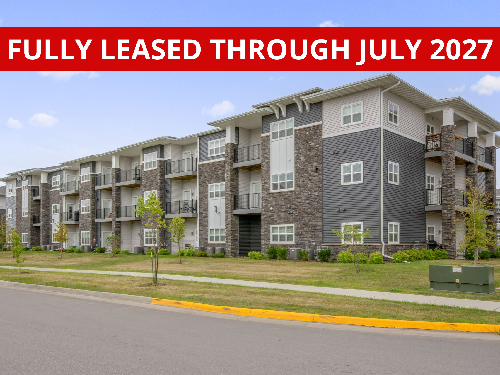 Exterior view of Aurora Heights, a modern apartment complex in Ames, IA offering convenient living spaces close to local & ISU amenities.