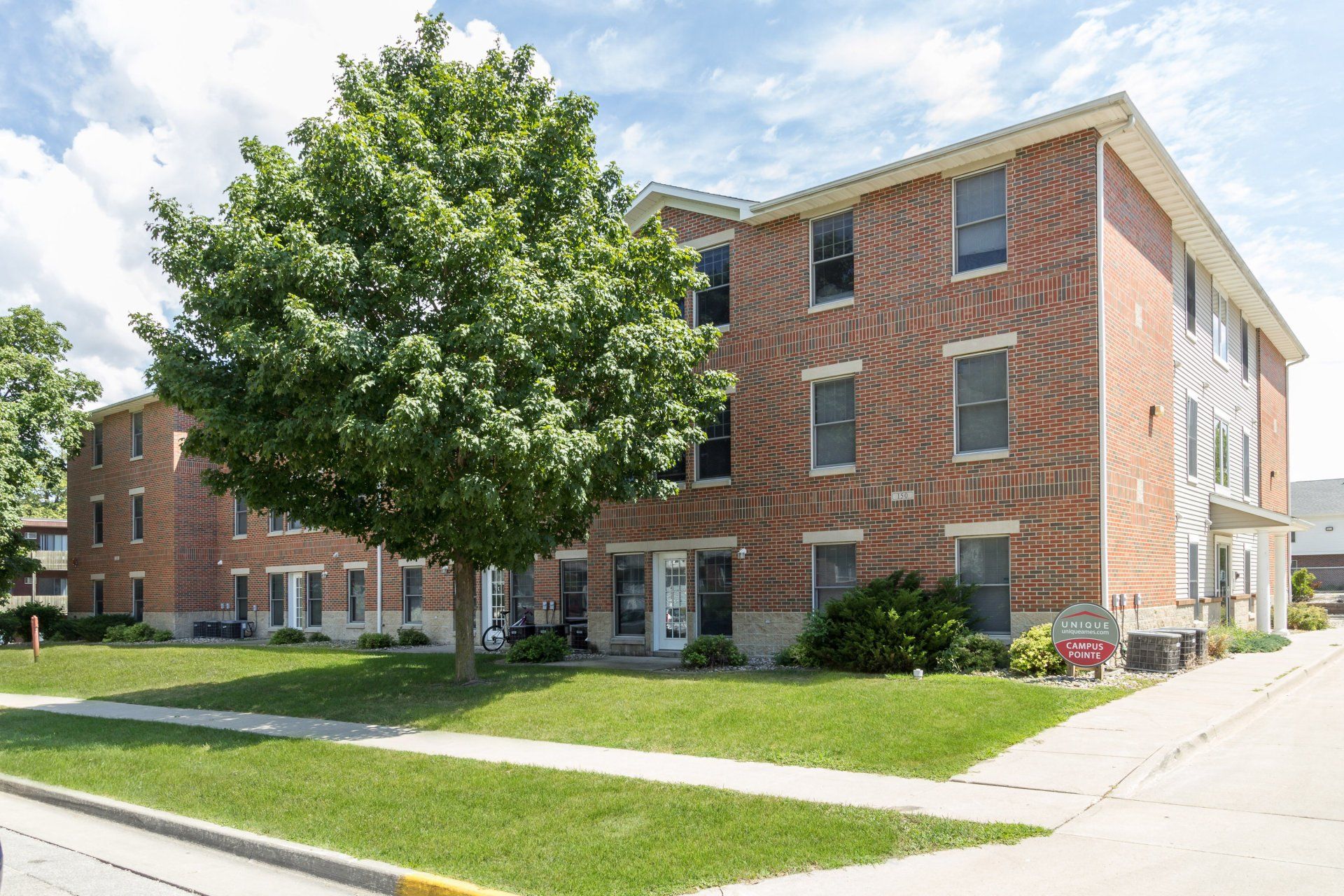 Exterior view of 150 Campus, a comfortable apartment building in Ames, IA offering convenient living spaces close to ISU amenities.