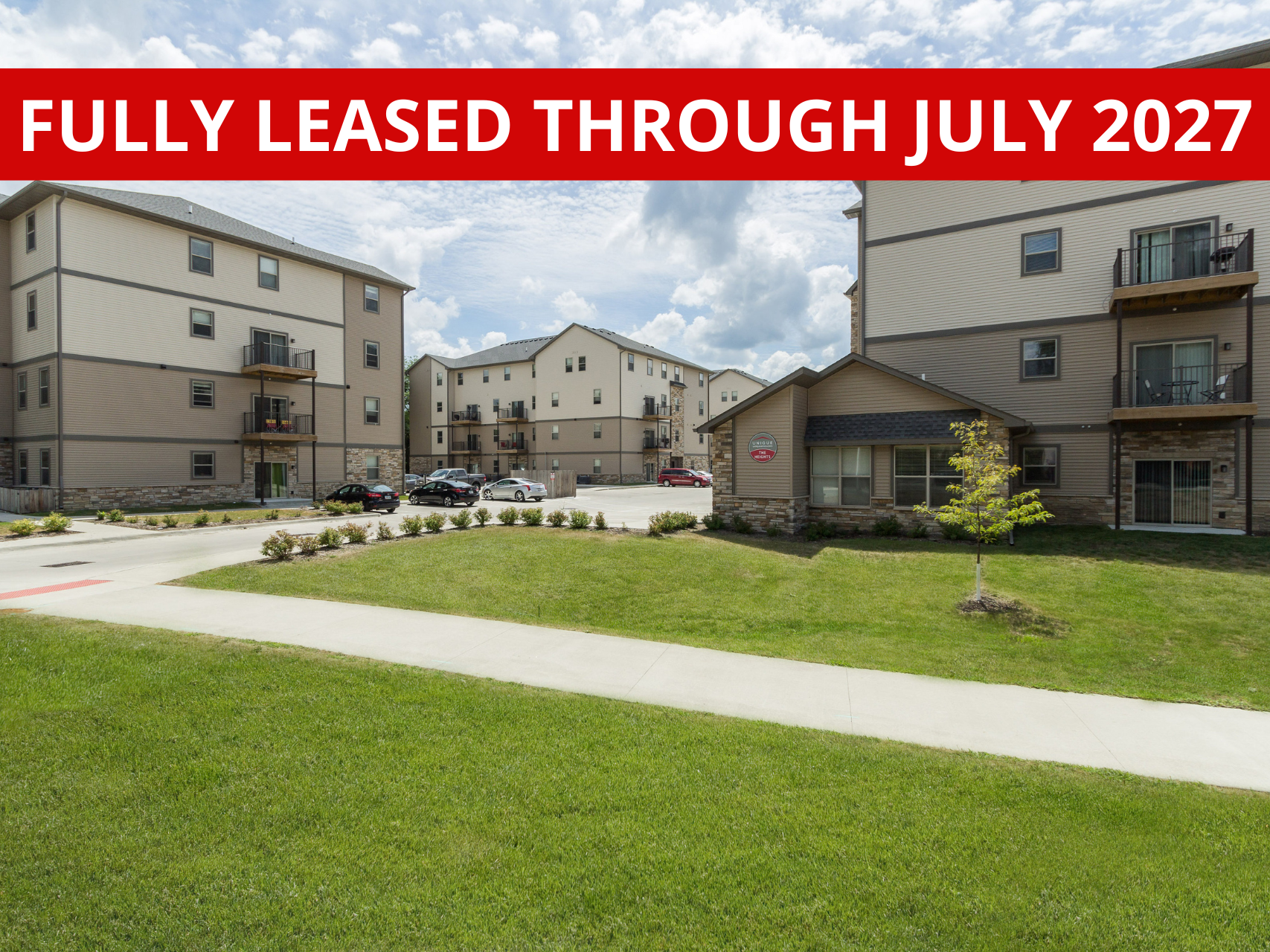 Exterior view of The Heights at Lincoln Swing, a modern apartment complex in Ames, IA offering convenient living spaces close to local & ISU amenities.