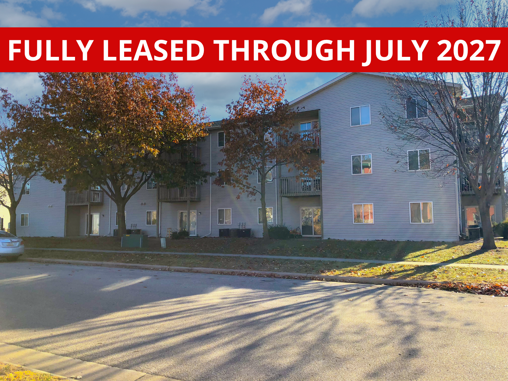 Exterior view of Timbercreek, a modern apartment building in Ames, IA offering convenient living spaces close to local & ISU amenities.