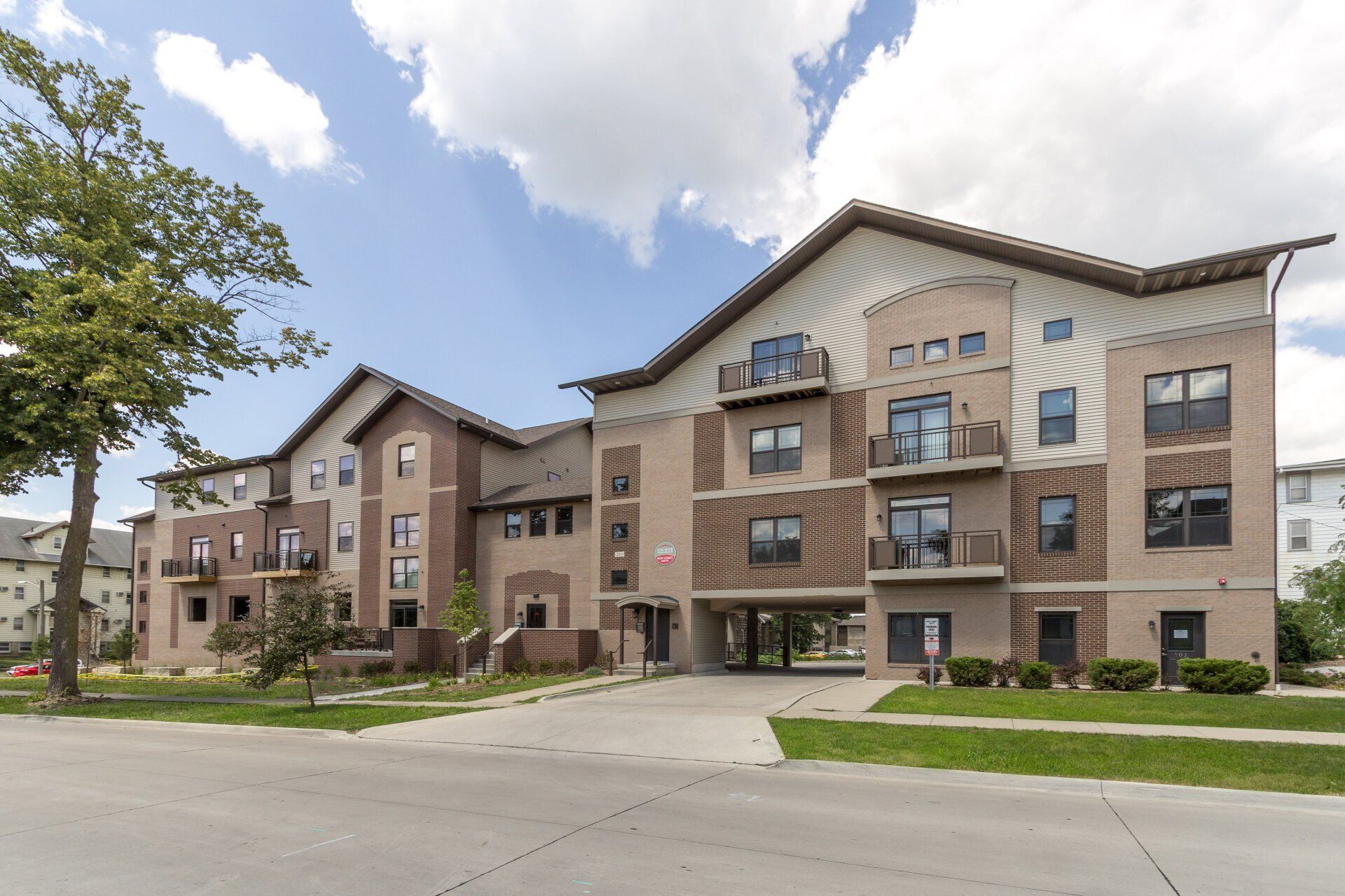 Exterior view of West Street Lofts, a modern apartment building in Ames, IA offering convenient living spaces close to ISU amenities.