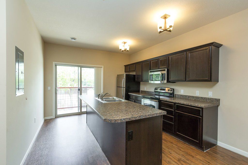 Interior view of a modern apartment unit at Unique Apartment Homes in Ames, IA, featuring spacious living areas and contemporary finishes