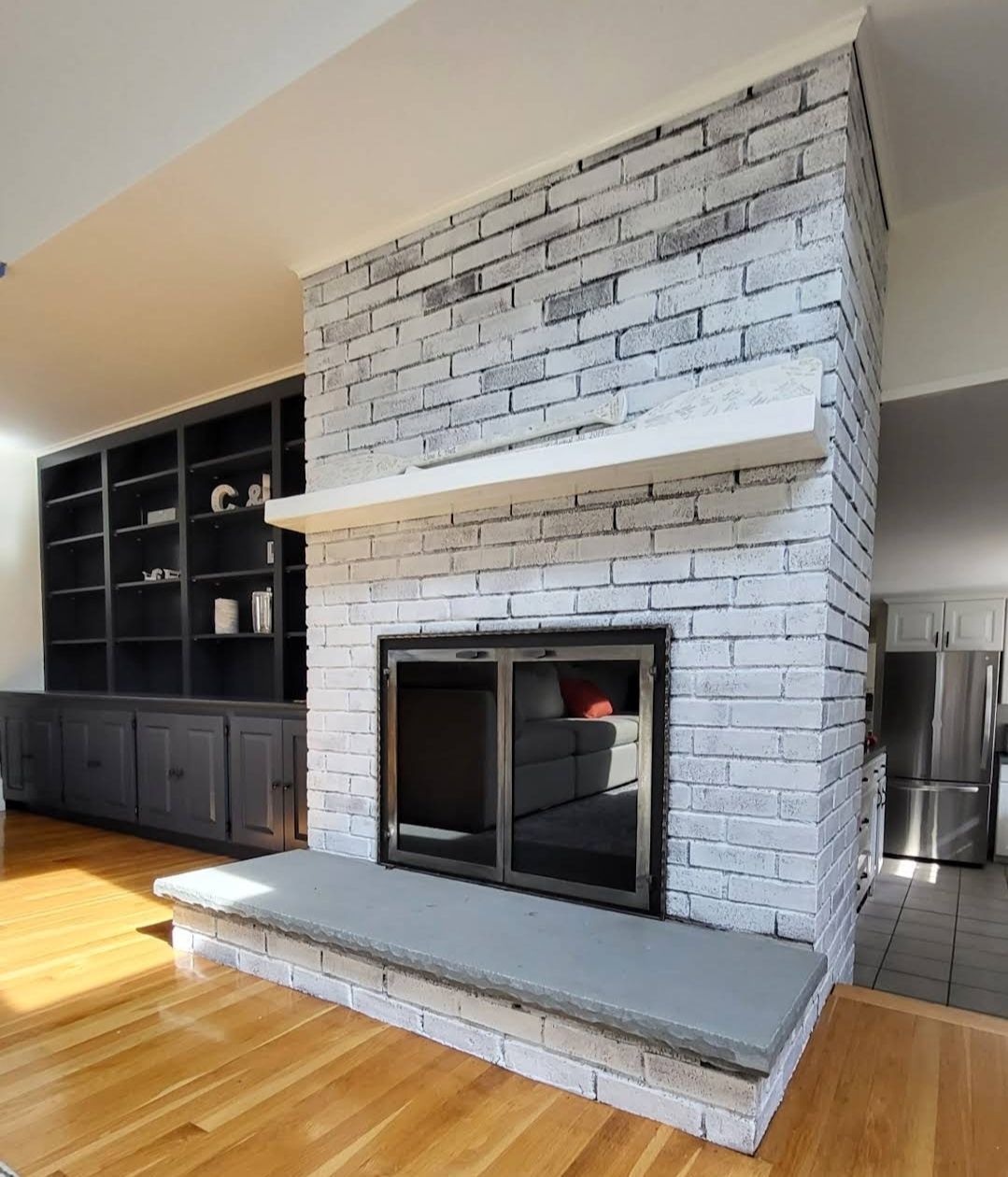 There is a fireplace in the middle of the room.