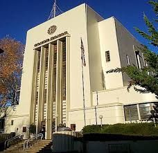 A large white building with stairs leading up to it.
