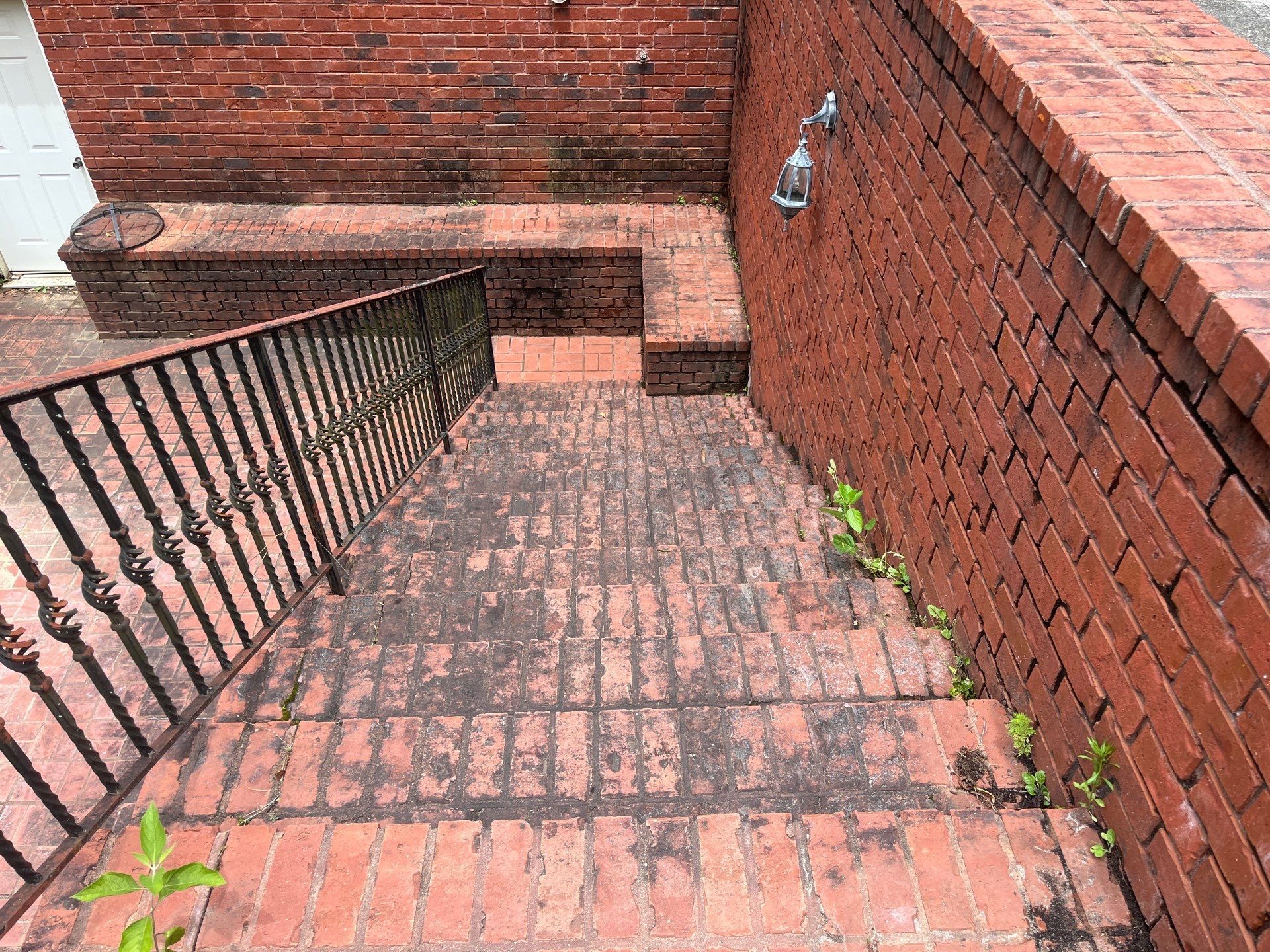 The back of a house with a window and air conditioner.