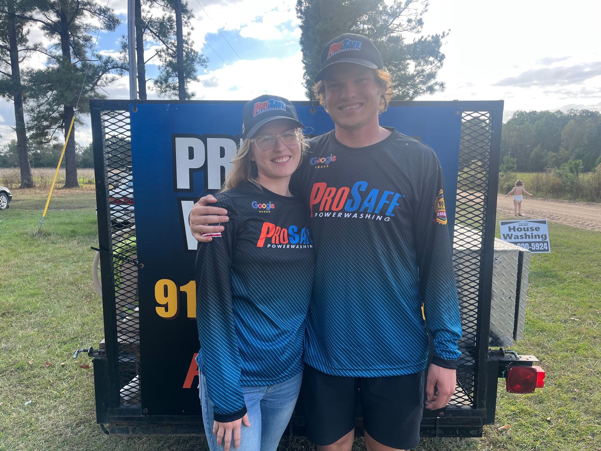 a man and a woman wearing prosafe powerwashing shirts