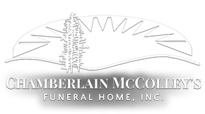 Chamberlain McColley's Funeral Home, Inc. logo with a sunrise arch and a tree outline.
