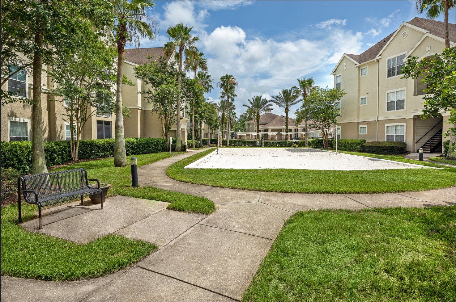 Eddison at Deerwood Park | Apartment Walking Trail leading to Sand Volleyball Court