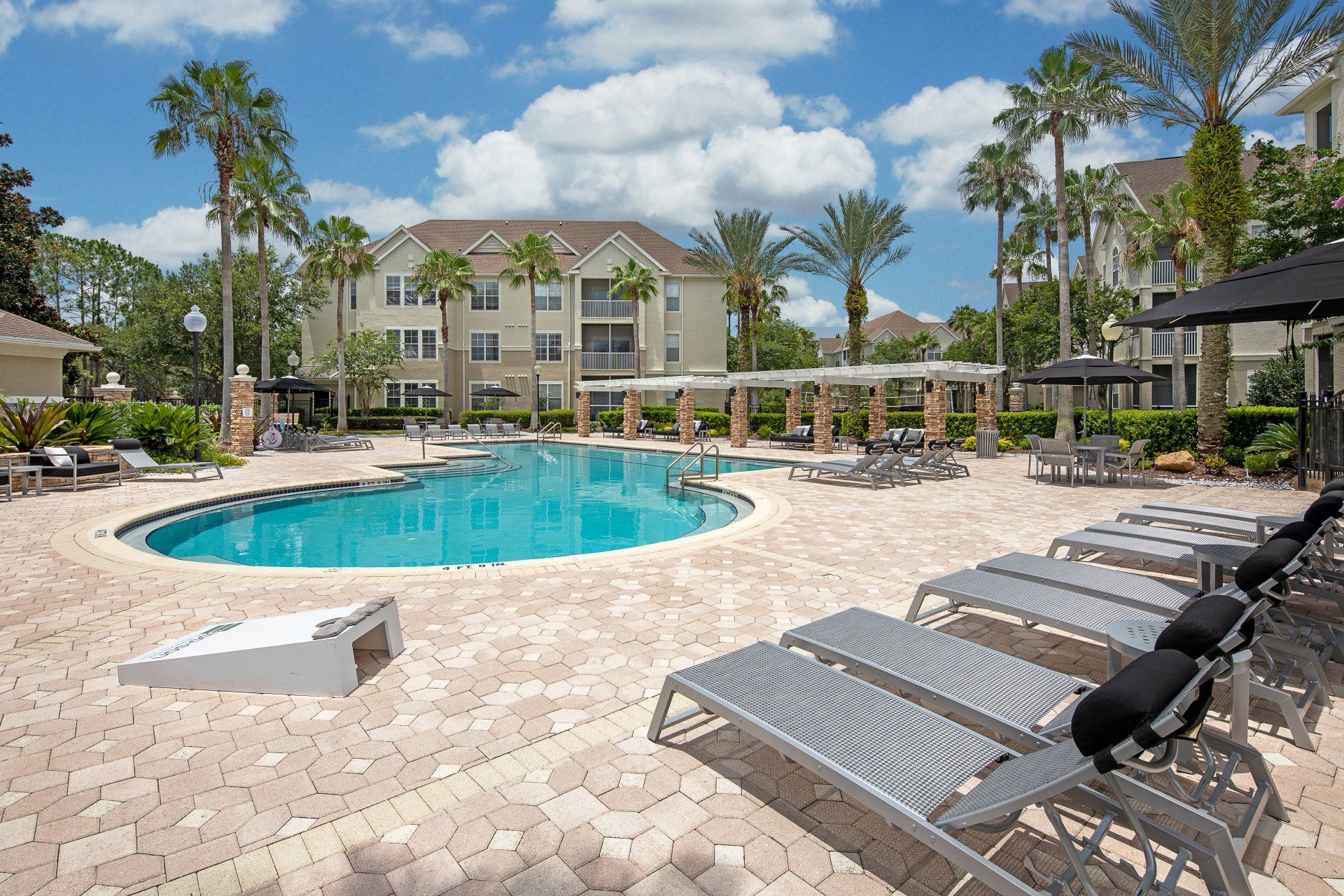 Eddison at Deerwood Park | Outdoor Swimming Pool with Chaise