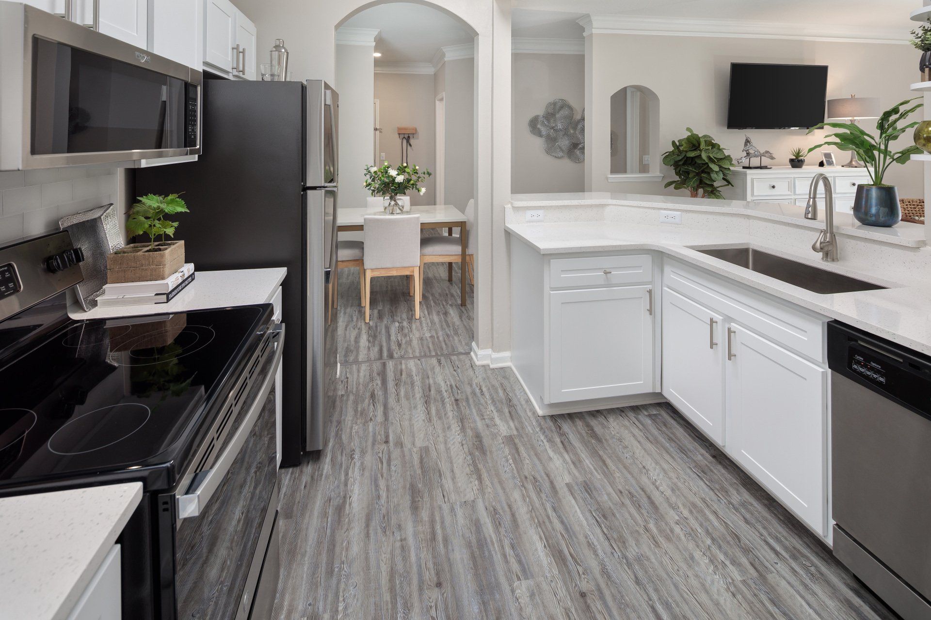 Kitchen with Refrigerator, Dishwasher, and Microwave | Eddison at Deerwood Park
