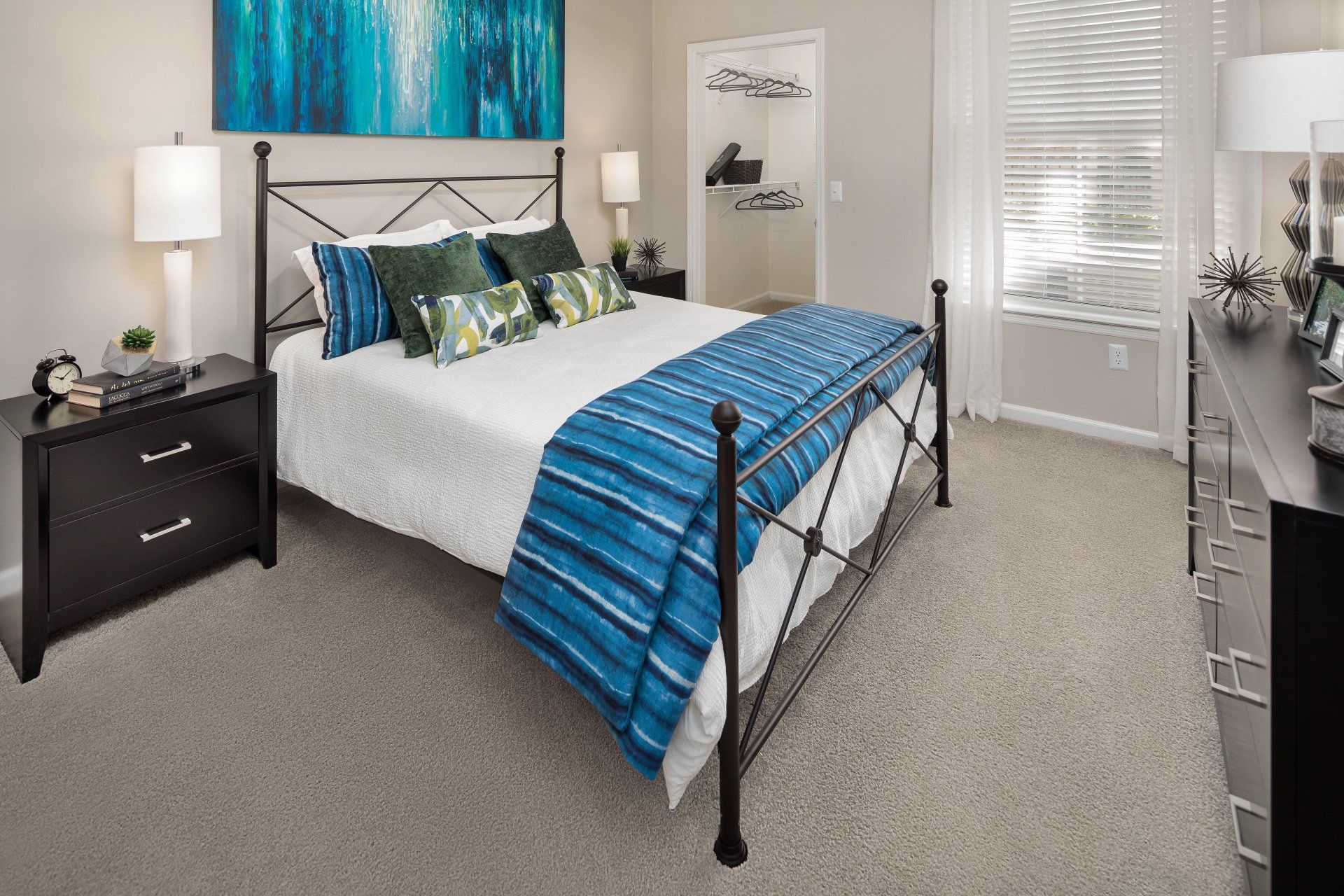 Bedroom with Bed and Blue Wall Art | Eddison at Deerwood Park