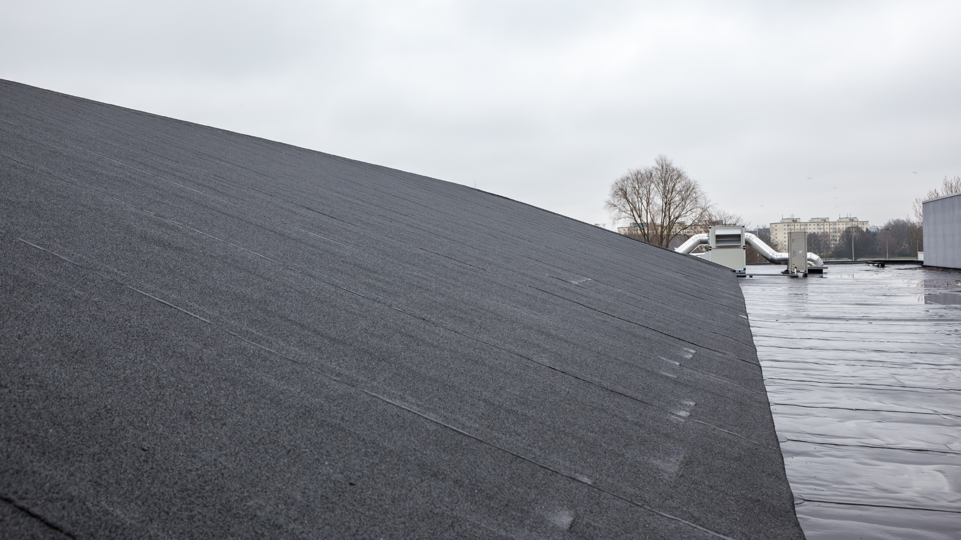 A close up of a roof with a lot of shingles on it.