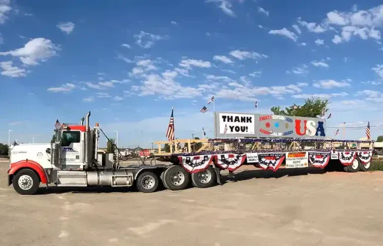 A large semi truck is parked in a parking lot.