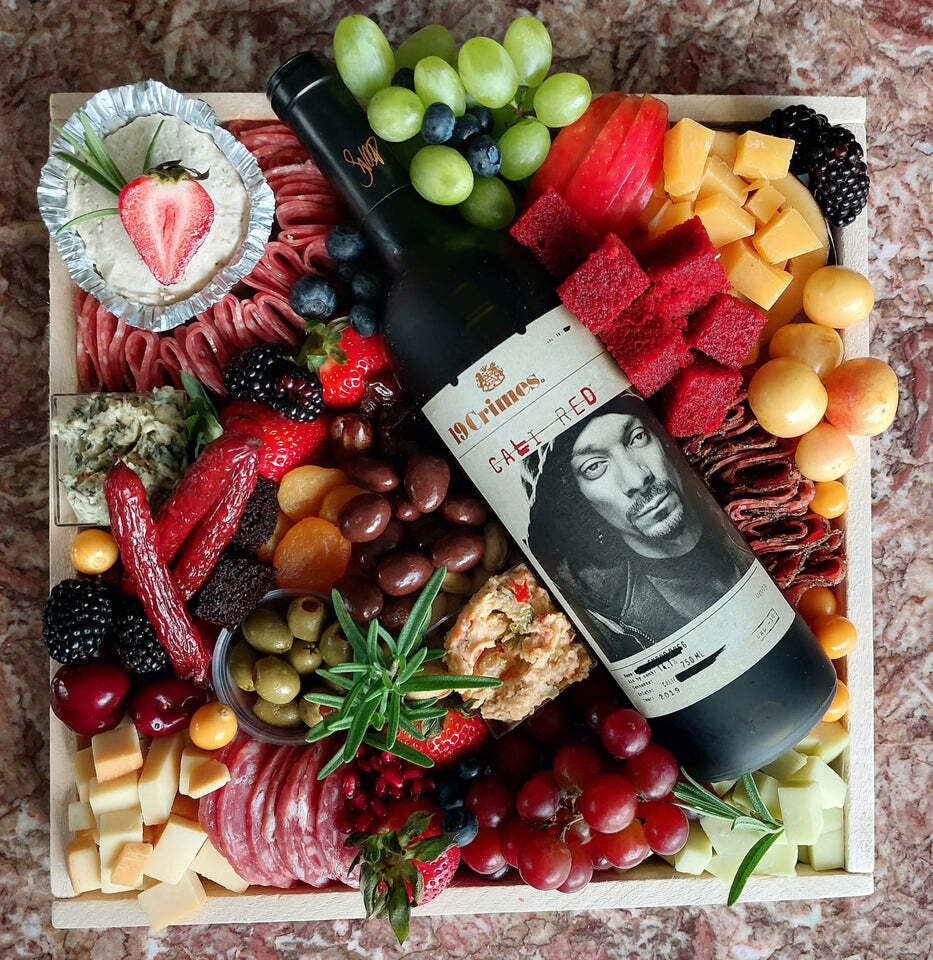 A bottle of wine has a picture of snoop dogg on the label