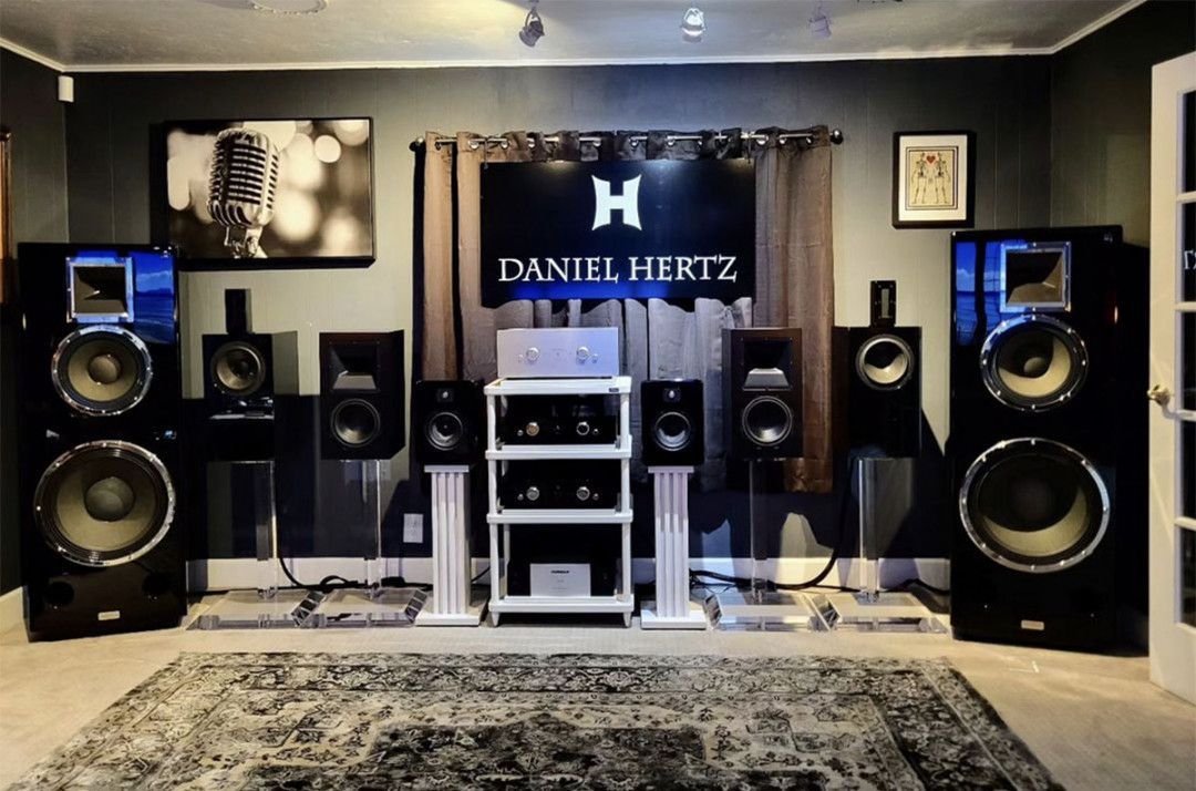 A room with speakers and a sign that says Daniel Hertz