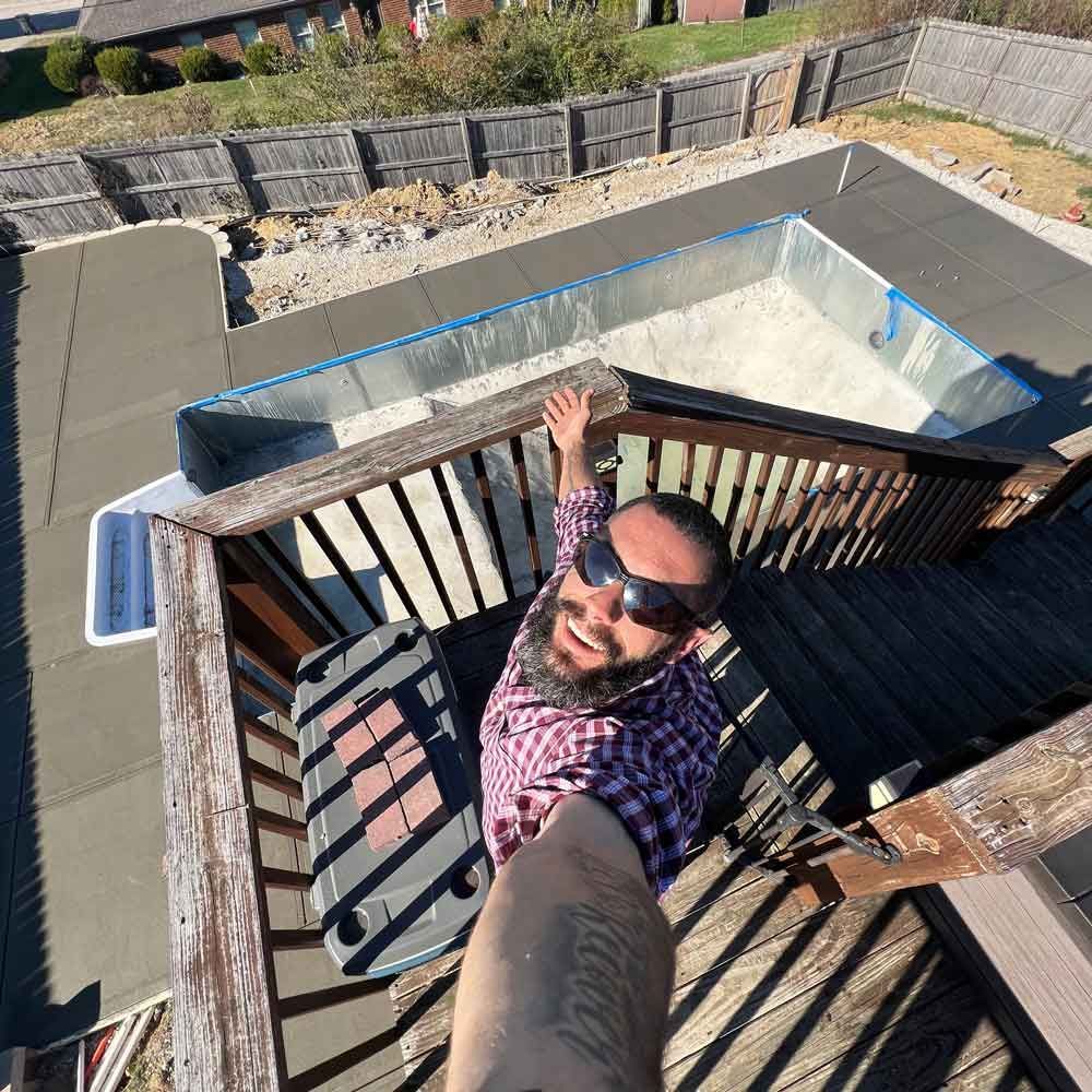 Man Taking a Photo During Construction — Winchester, KY — Underground Kings, LLC