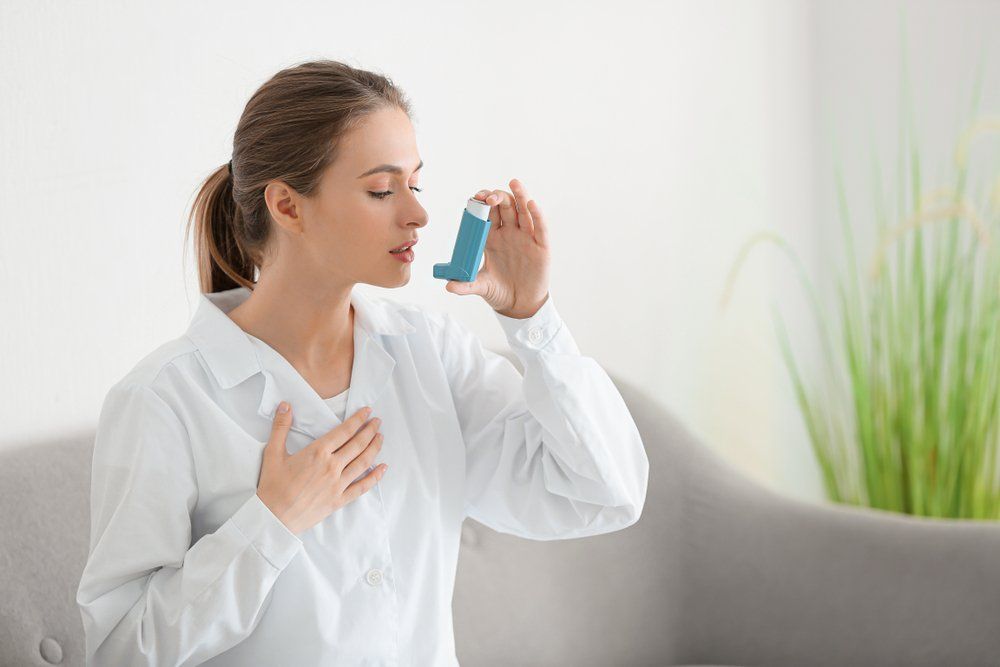 female doctor with inhaler