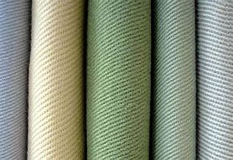 A close up of a row of different colored fabrics.