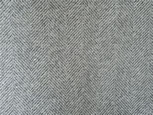 A close up of a gray fabric with a herringbone pattern.