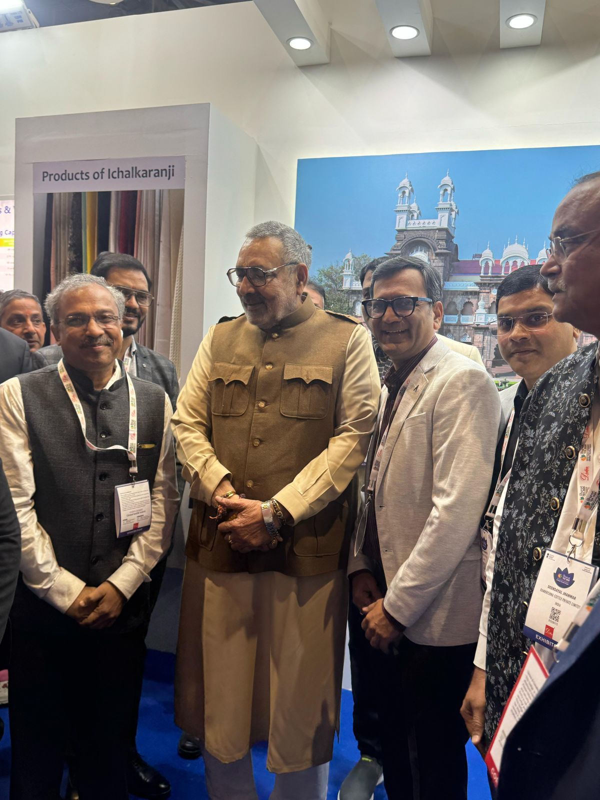 A group of men are standing next to each other in a room.