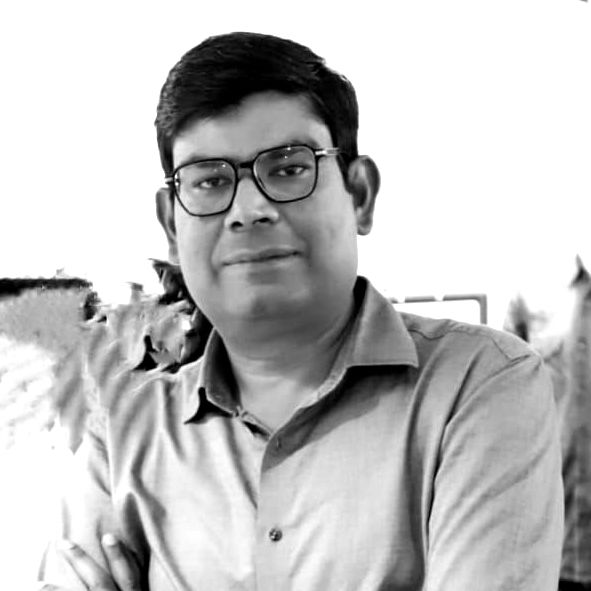 A black and white photo of a man wearing glasses and a shirt.