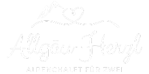 Ein weißes Logo mit einem Herz in der Mitte auf weißem Hintergrund.