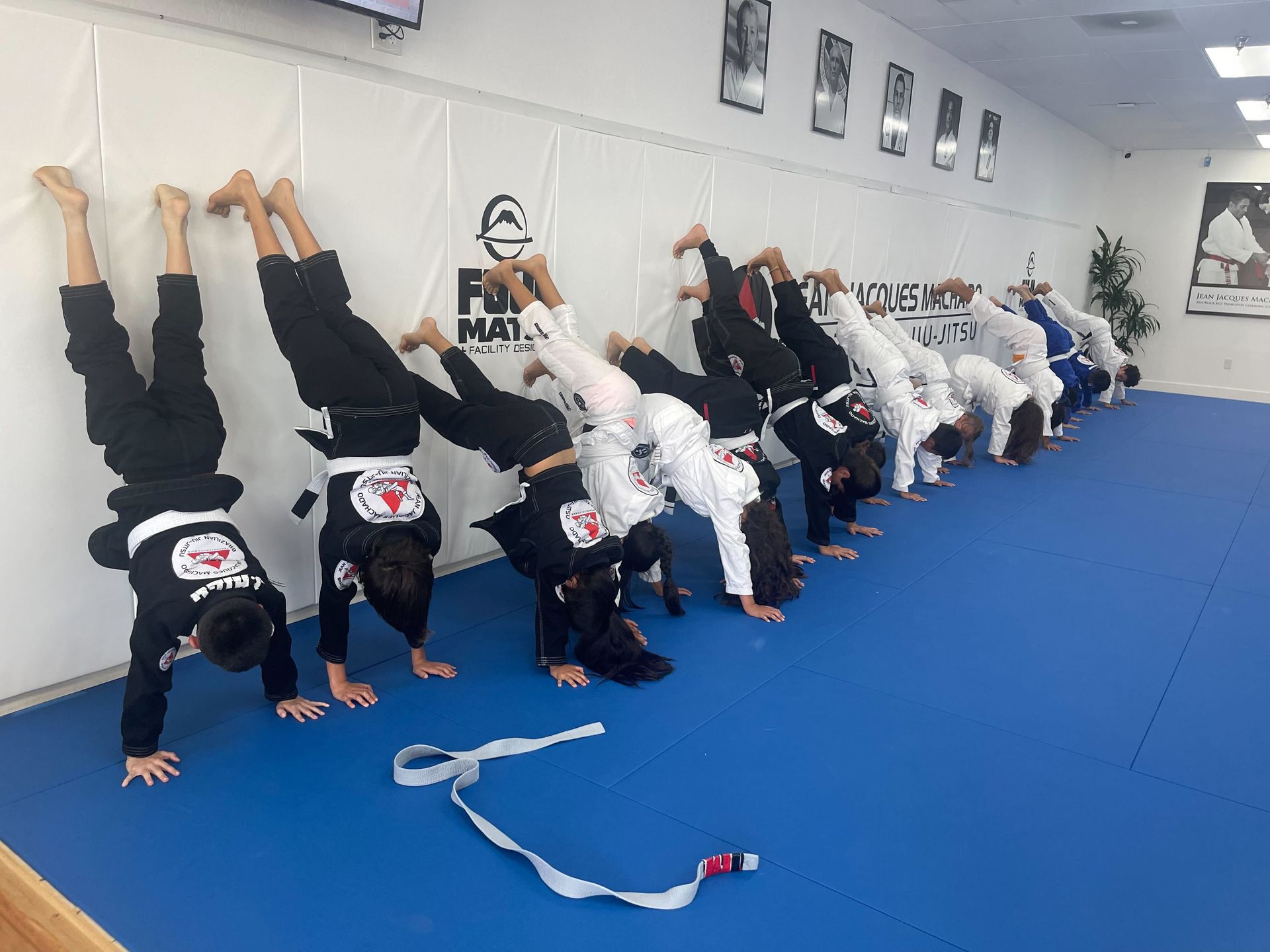Kids and teens in Fresno practicing Brazilian Jiu-Jitsu at Jean Jacques Machado Academy.