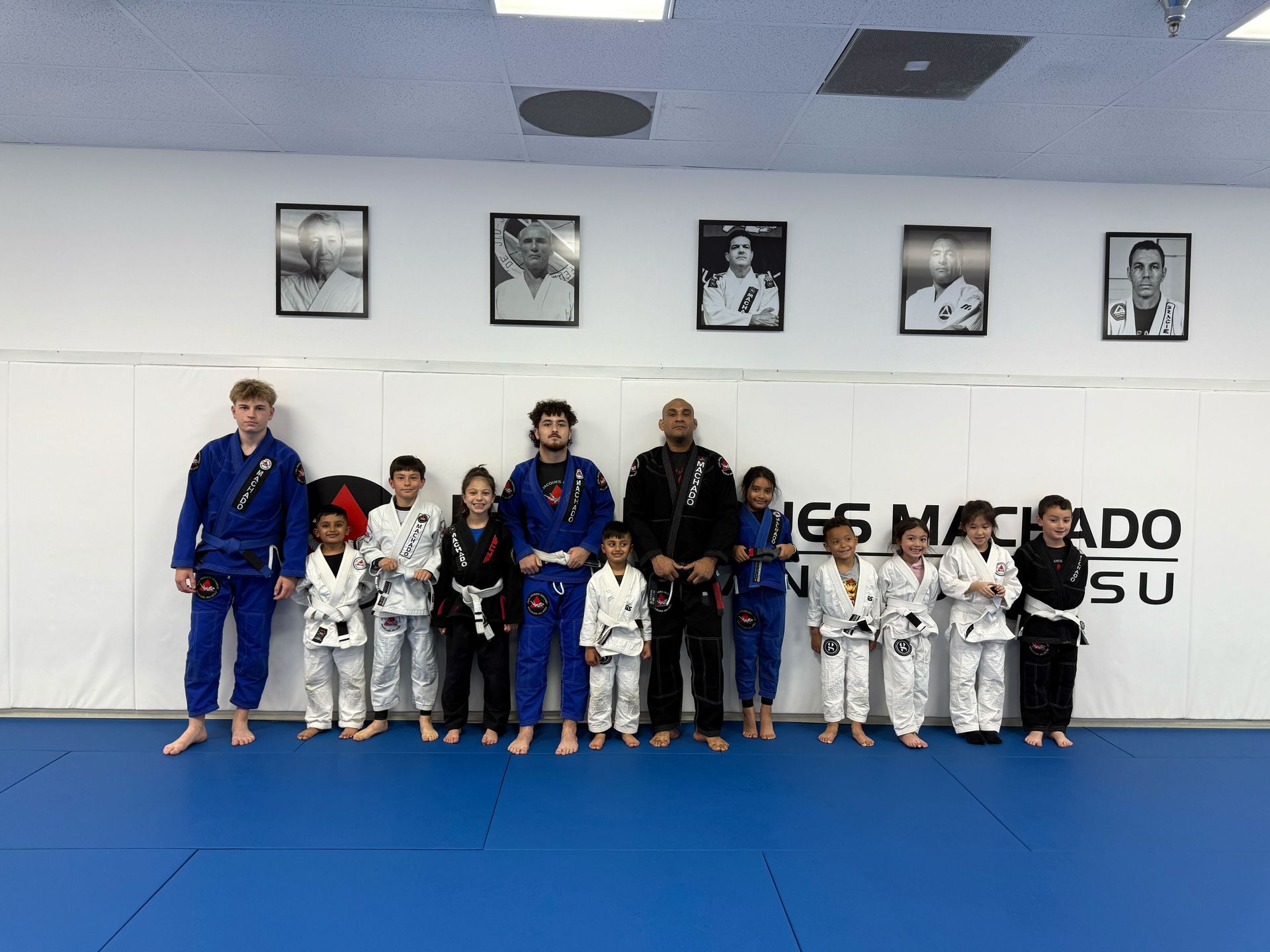 Kids practicing Brazilian Jiu-Jitsu at Jean Jacques Machado Fresno to build leadership and teamwork.