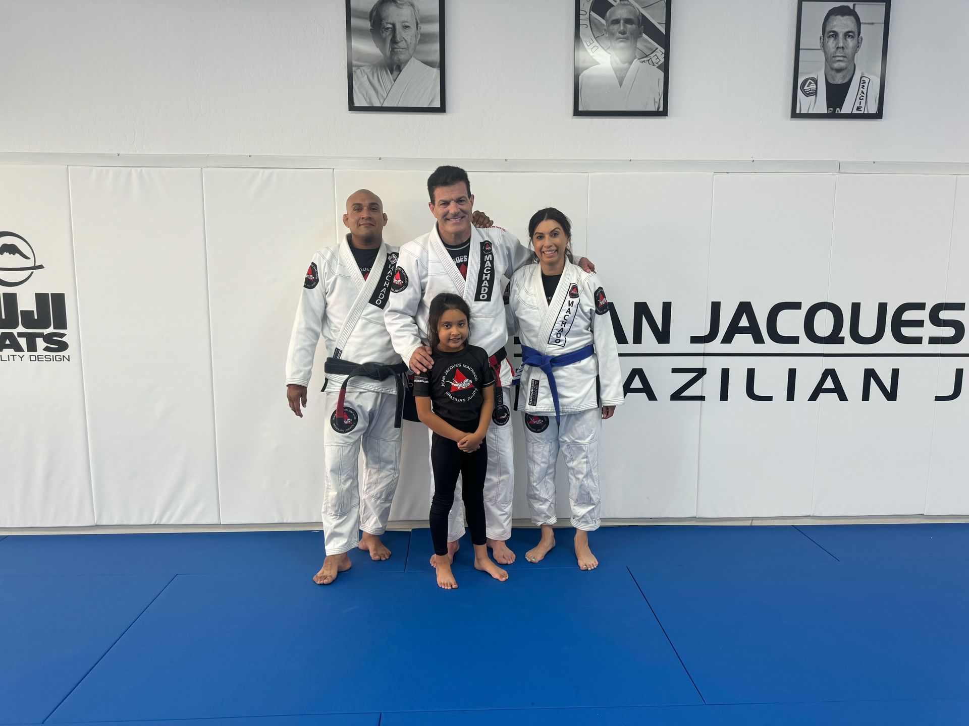 Kids in Fresno learning Brazilian Jiu-Jitsu at Jean Jacques Machado Academy with guidance.