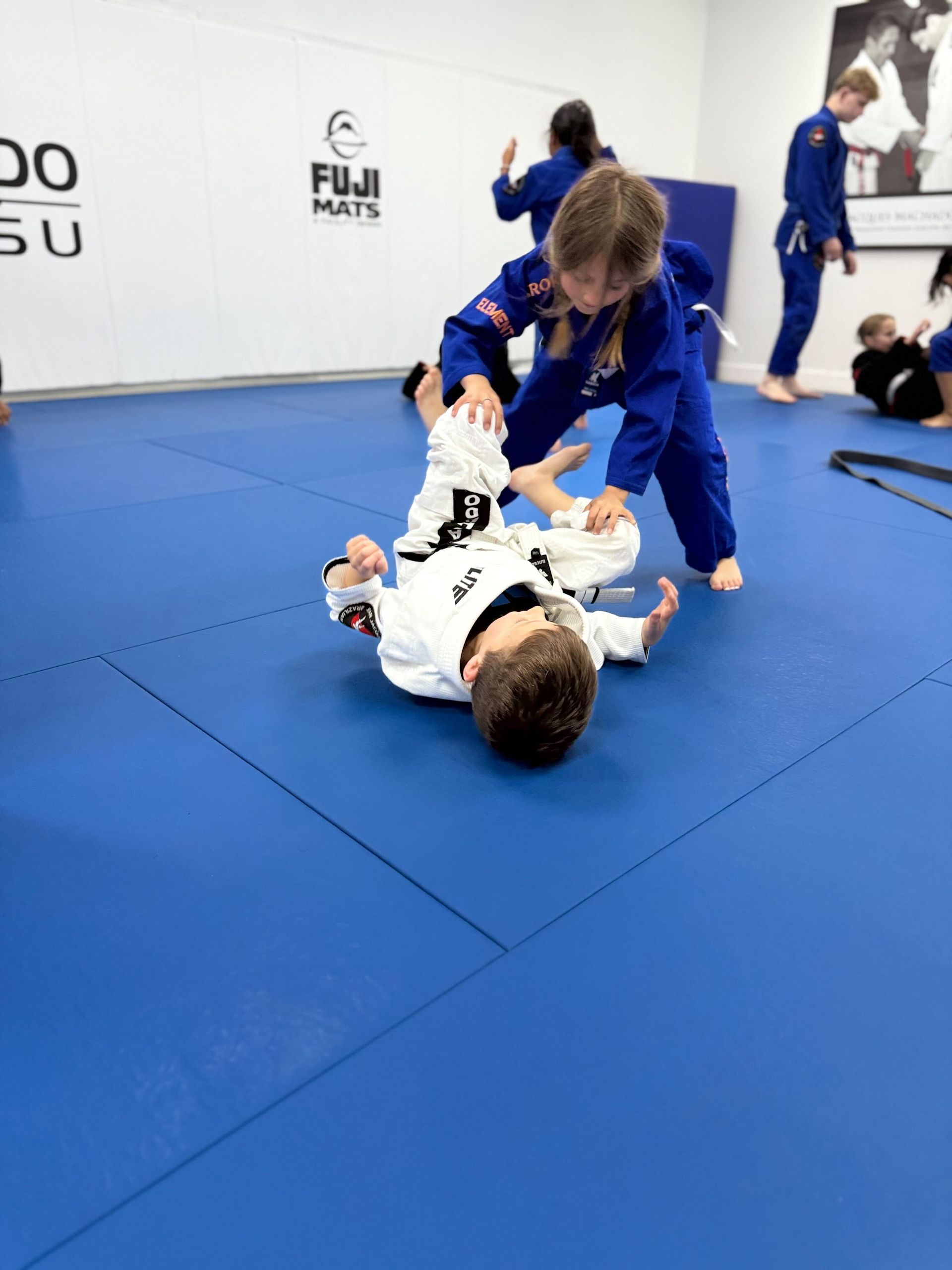 Students at Jean Jacques Machado Fresno exploring the history and origins of Brazilian Jiu-Jitsu