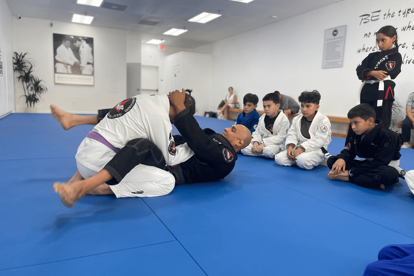 Adults practicing controlled grappling at Jean Jacques Machado Jiu-Jitsu Fresno in Fresno, building real self-defense skills.