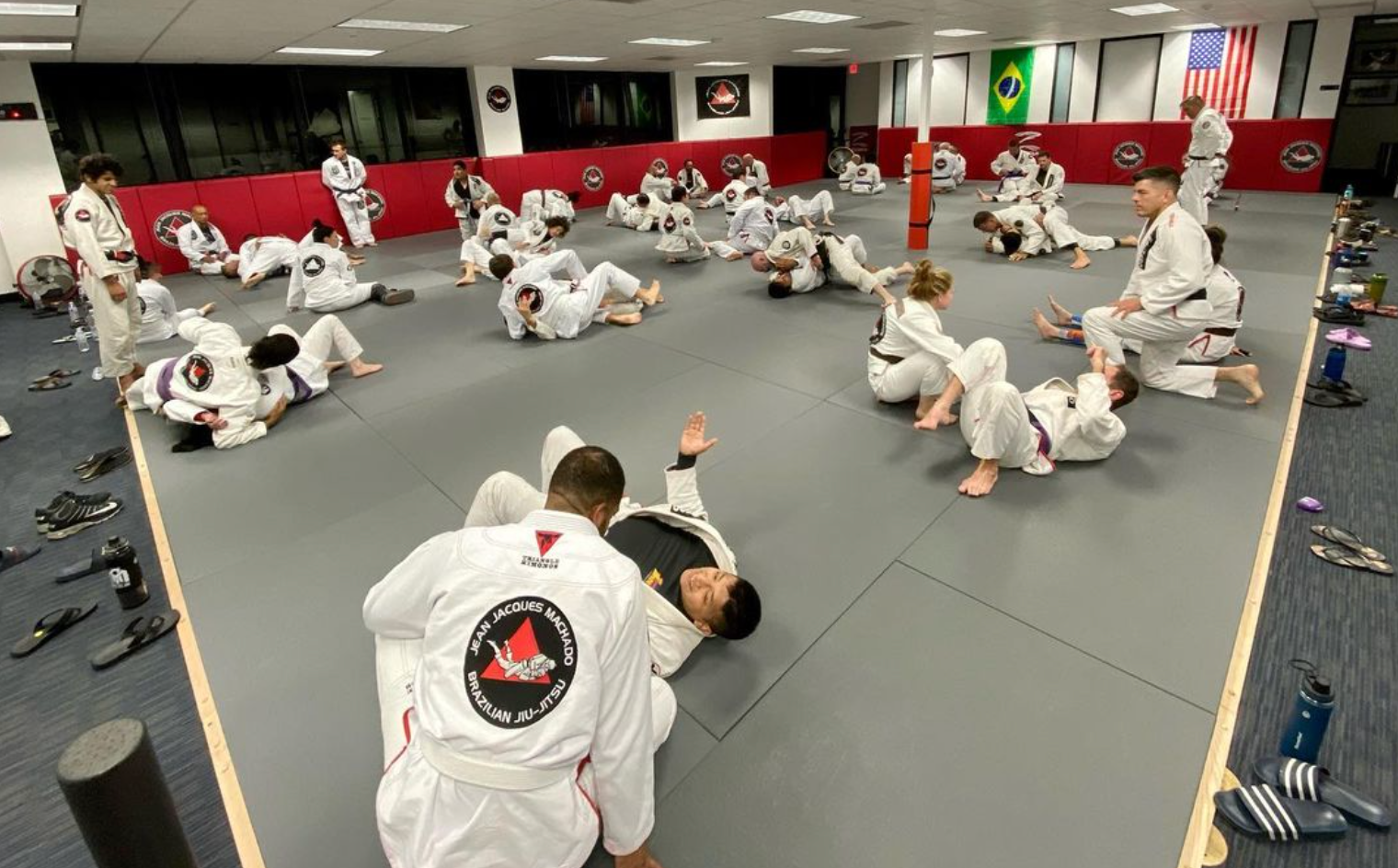 Adults training Brazilian Jiu Jitsu at Jean Jacques Machado Fresno in Fresno, CA, building fitness .