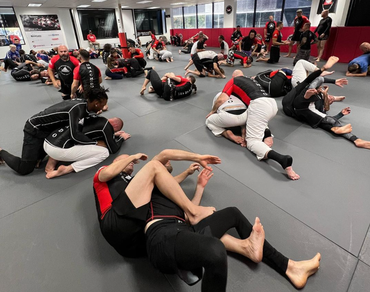 Adults practicing self-defense grappling at Jean Jacques Machado Jiu-Jitsu Fresno in Fresno, CA for confidence and safety