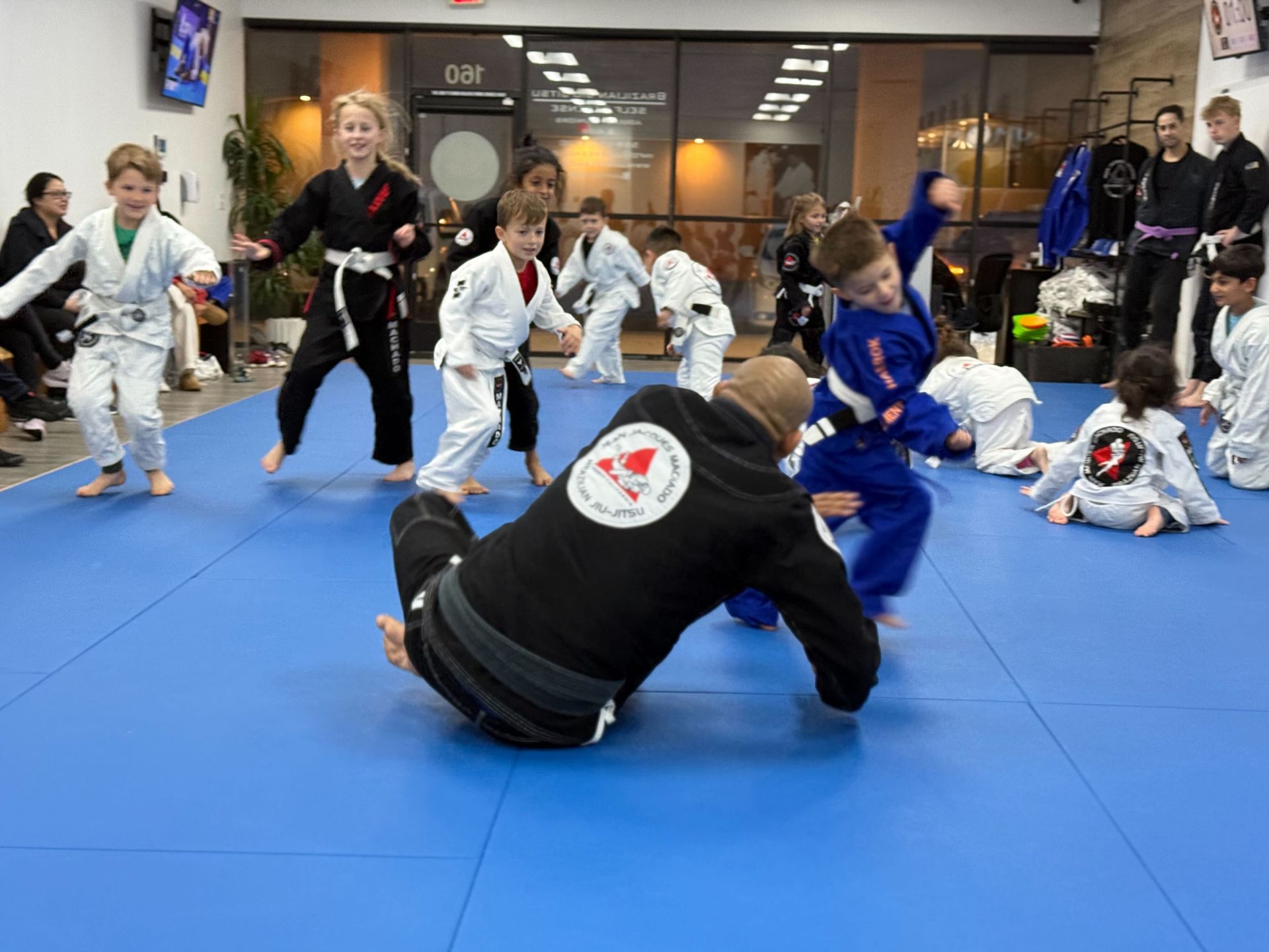 Kids practicing Brazilian Jiu-Jitsu drills at Jean Jacques Machado Jiu-Jitsu Fresno in Fresno, CA, building leadership.