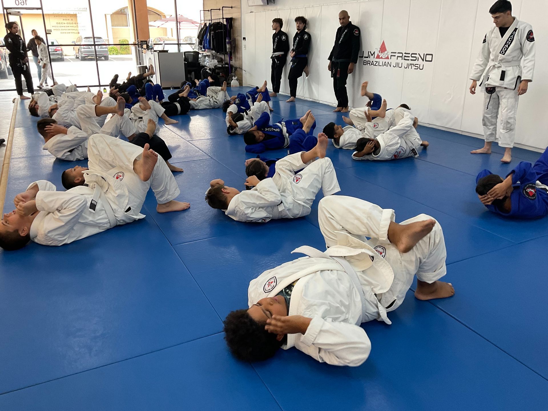 Kids practicing calm partner drills at Jean Jacques Machado Jiu-Jitsu Fresno in Fresno, CA.