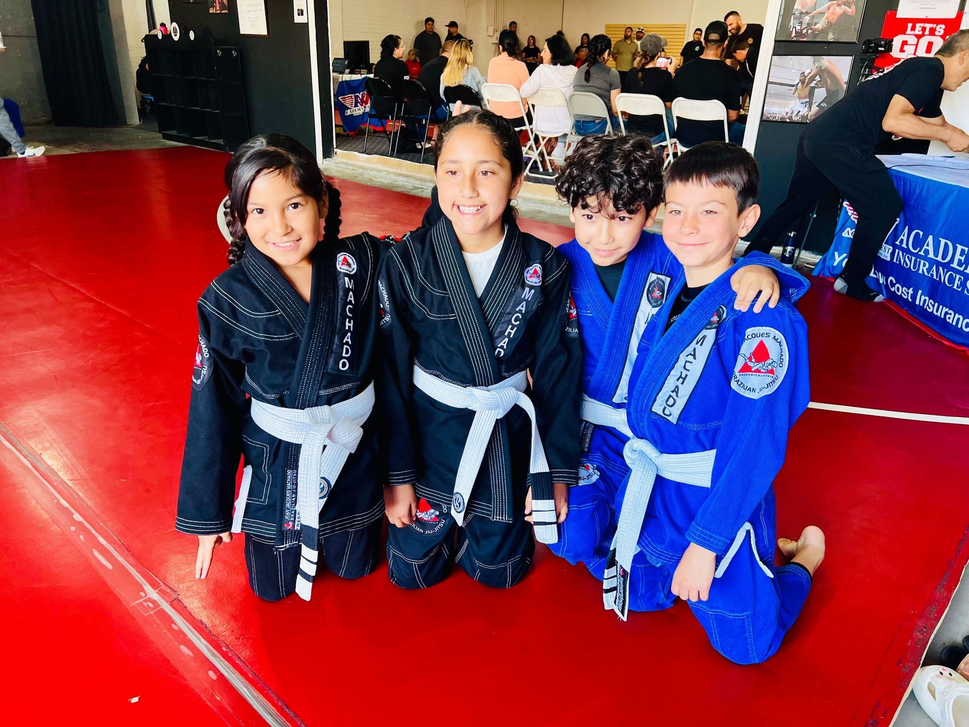 Children practicing Brazilian Jiu Jitsu at Jean Jacques Machado Fresno to build confidence.