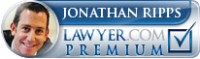 Jonathan Ripps, Lawyer.com Premium. Smiling man with a checkmark.