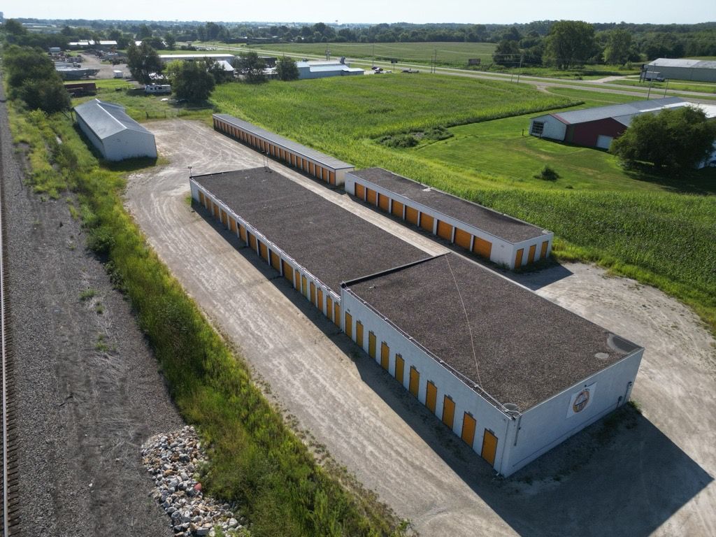 An aerial view of a storage facility in the middle of a field.