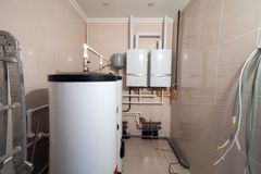 A Room with Two Boilers and a Water Heater in it — Scotts Valley, CA — George Allen & Sons Inc. Plumbing