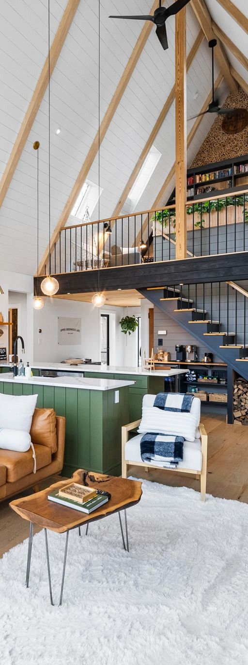 City skyline of tall buildings along a body of water under a blue sky.