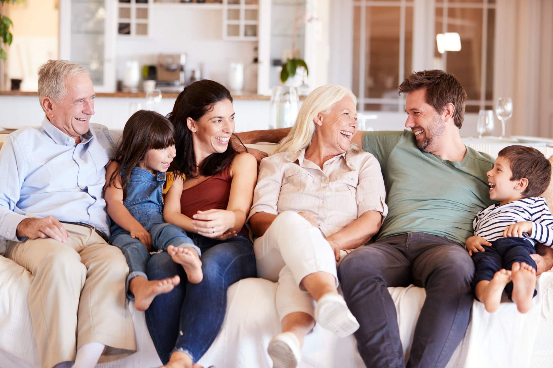 A family posing for a picture in their newly constructed accessory dwelling unit (ADU) backyard home