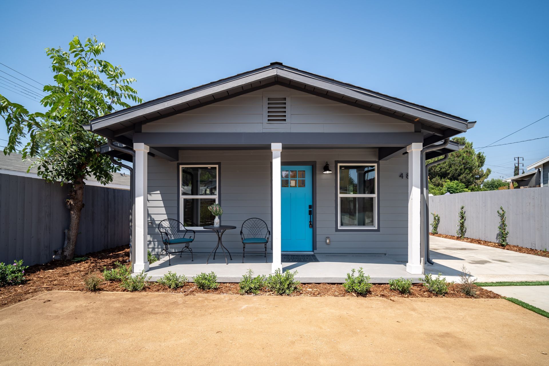 The gable-roofed porch of an accessory dwelling unit (ADU) backyard casita in Los Angeles, CA.