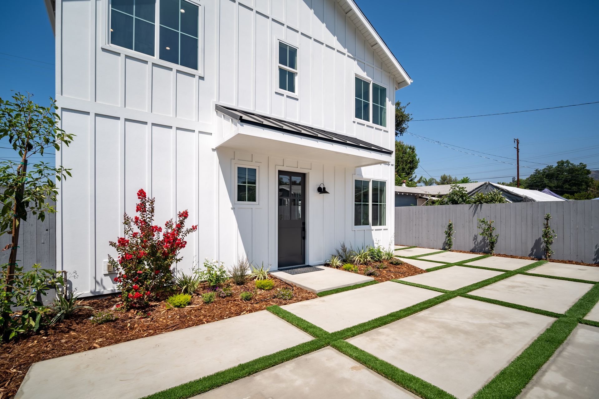 The landscaping and entrance to a 1200 square foot, three-bedroom, two story accessory dwelling unit (ADU) backyard home built in Los Angeles, CA.
